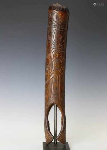 Papua Barat, Asmat, bamboo fu horncarved in the form of a standing anthropomorphic figure and