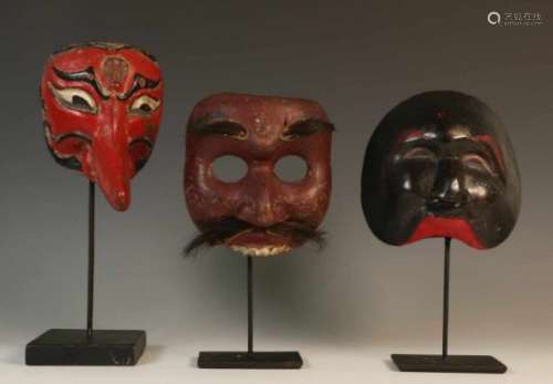 Java, three topeng masks, ca. 1930., h. 12, 15 and 15 cm. [3]400