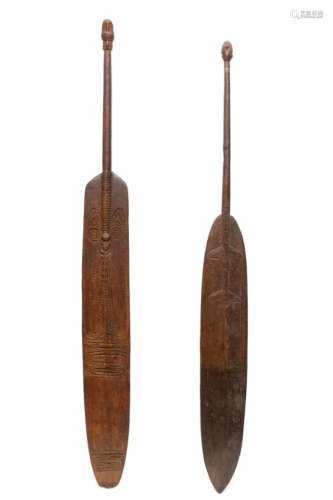 PNG, Sepik, two large ceremonial carved wooden peddles, carved with curved lineair decoration, one