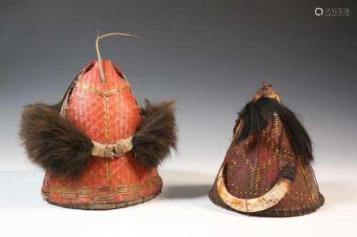 India, Naga, two rattan warrior headsdecorated with boar teeth and human hair, h. 19 and 21 cm. [2]