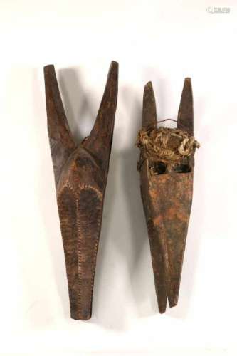 Bamana, two antilope masksboth with holes for attachement. One with encrusted patina and bound