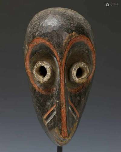 Pende, small maskwith tubular eyes and red, black and white pigment. Private collection Berlin, h.