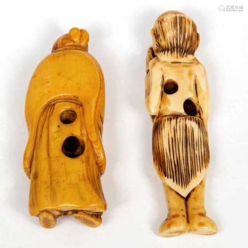 Japan, twee ivoren netsuke, Meiji periode,een van een figuur in lange gewaden, de ander van een