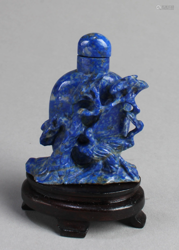 A Carved Lapis Snuff Bottle With Stand