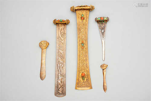 A group of 5 silver repoussé hair pins  19th century