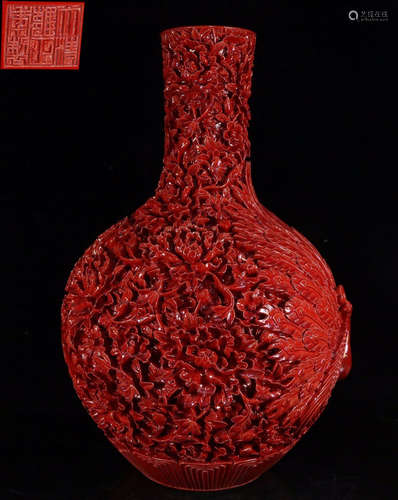 A RED LACQUER VASE CARVED WITH PATTERN