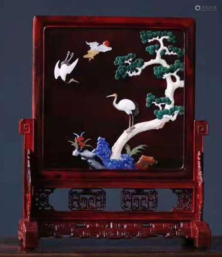 A ZITAN WOOD SCREEN EMBEDDED WITH GEM