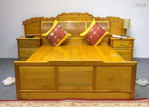 A GOLD WOOD BED WITH TWO CABINET