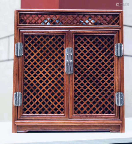 A HUALI WOOD TEA CABINET WITH PATTERN