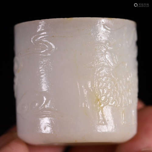 A HETIAN JADE CARVED RING WITH QILIN PATTERN