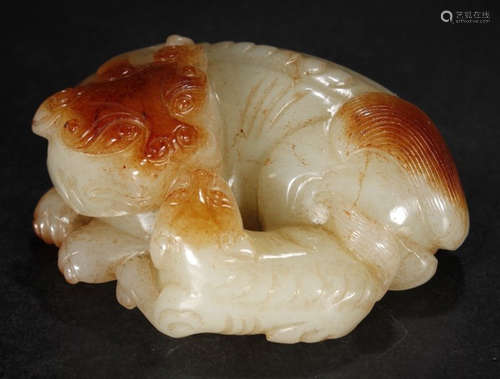 A HETIAN JADE BEAST PENDANT