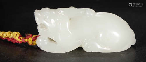 A HETIAN JADE BEAST PENDANT