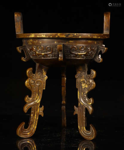 A BRONZE CENSER WITH TWO EARS