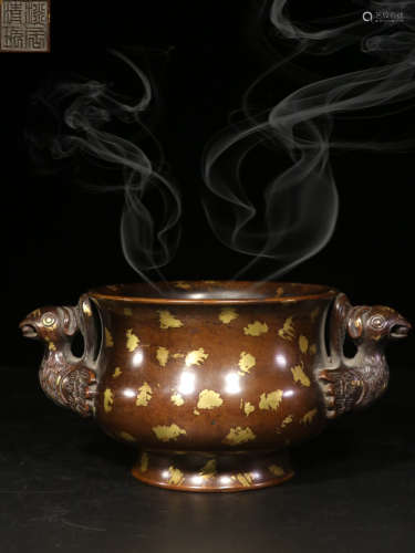 A COPPER CENSER WITH PHOENIX EARS