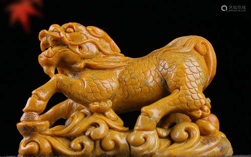 A SOAPSTONE CARVED QILIN