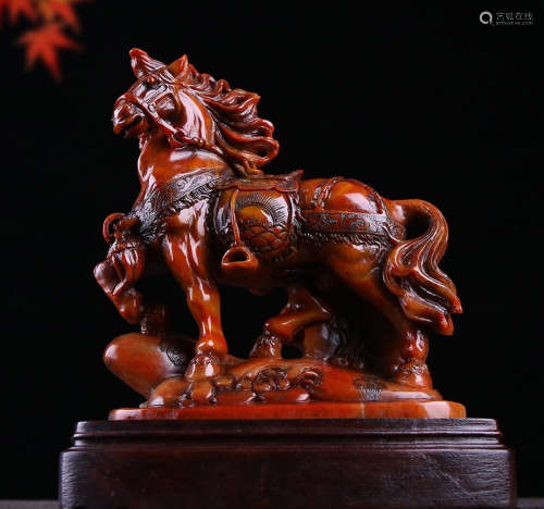 A SOAPSTONE CARVED HORSE