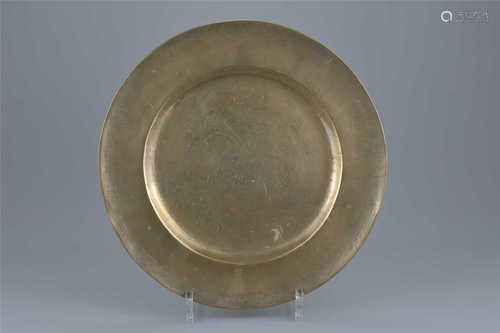 A Chinese polished bronze dish with incised decoration