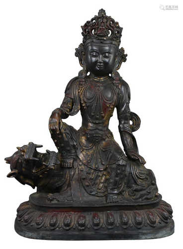 A Large Tibetan Bronze Figure of a Seated Buddha on a Mythical Beast