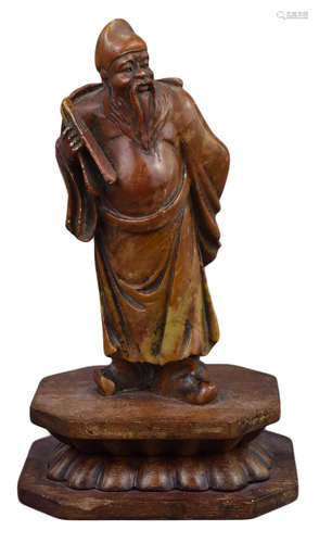 A Chinese Carved Soapstone Figure of a Scholar