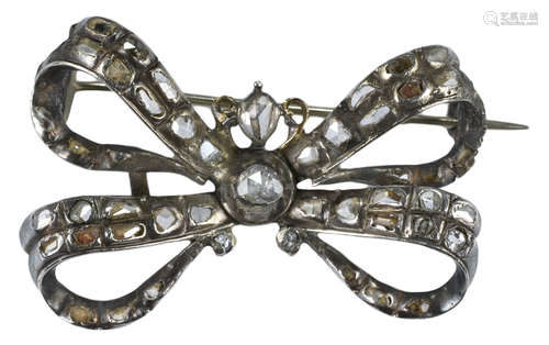 An antique white metal (unmarked) and old cut diamond bow brooch