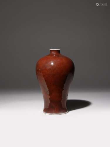 A CHINESE COPPER-RED GLAZED MEIPING 18TH CENTURY The ovoid body tapering and then gently flaring