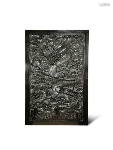 A CHINESE HARDWOOD RECTANGULAR 'DRAGON' PANEL 19TH CENTURY One side carved in relief with a dragon