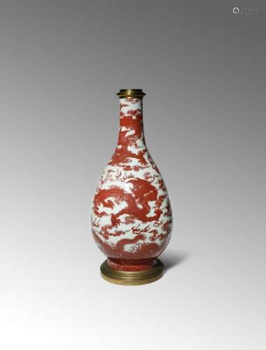 A LARGE CHINESE COPPER-RED 'FIVE DRAGON' VASE 18TH CENTURY The pear-shaped body with a tall tapering