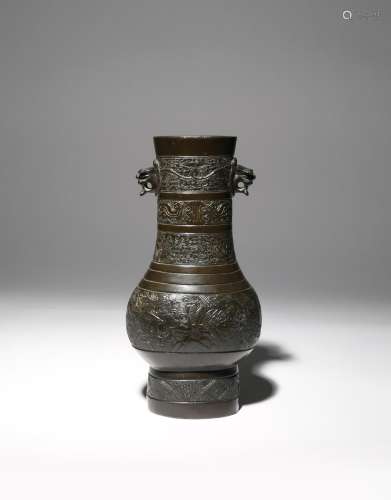 A CHINESE BRONZE ARCHAISTIC HU-SHAPED VASE SOUTHERN SONG DYNASTY The pear-shaped body surmounted