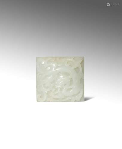 A CHINESE PALE CELADON JADE 'CHILONG' BELT BUCKLE MING DYNASTY Of rectangular form, carved in relief