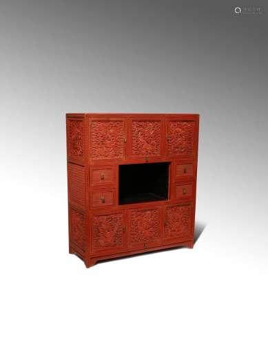 A RARE CHINESE IMPERIAL CINNABAR LACQUER 'DRAGON' CABINET QIANLONG 1736-95 The centre of the cabinet