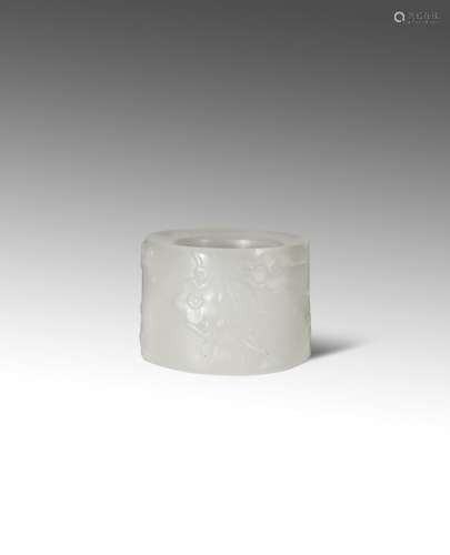 A CHINESE WHITE JADE 'PRUNUS' ARCHER'S RING QING DYNASTY Carved in low relief to the exterior with a