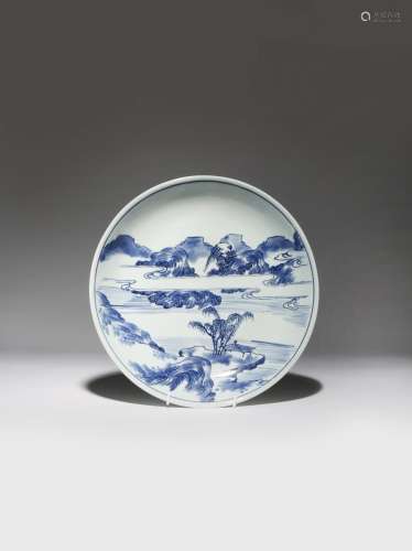 A CHINESE BLUE AND WHITE 'MASTER OF THE ROCKS' DISH KANGXI 1662-1722 Painted in underglaze blue with