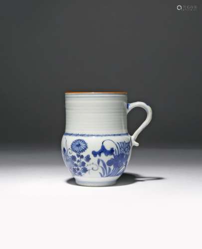 A SMALL CHINESE BLUE AND WHITE 'FOUR SEASONS' MUG KANGXI 1662-1722 Painted with peony,