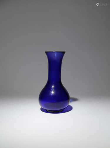 A CHINESE BEIJING BLUE GLASS VASE FOUR CHARACTER QIANLONG MARK AND OF THE PERIOD 1736-95 The pear-