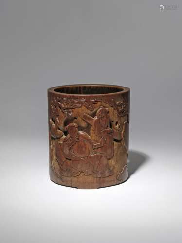 A CHINESE BAMBOO BRUSHPOT, BITONG QING DYNASTY The cylindrical body carved and pierced with a seated