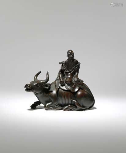 A CHINESE BRONZE 'LAOZI AND BUFFALO' INCENSE BURNER AND COVER 17TH CENTURY The cover formed as Laozi