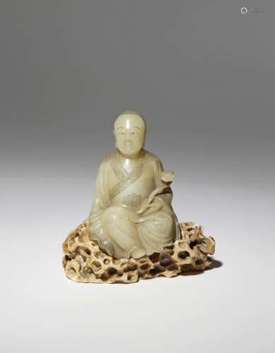 A CHINESE SOAPSTONE FIGURE OF A LUOHAN 18TH CENTURY Depicted seated upon a rocky pedestal with his