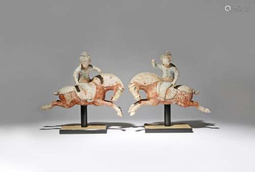 A PAIR OF CHINESE PAINTED POTTERY FIGURES OF POLO PLAYERS TANG DYNASTY Each formed as a lady