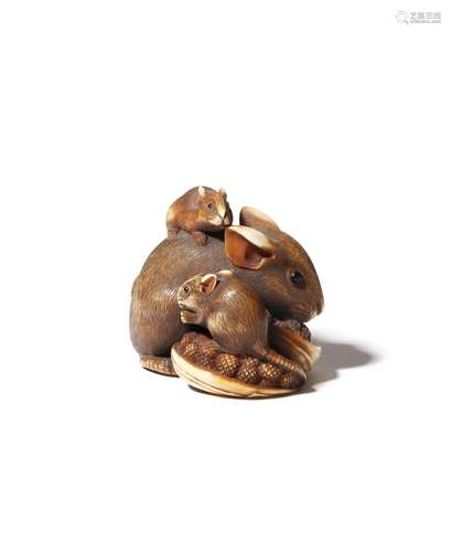 A JAPANESE IVORY NETSUKE OF RATS EDO OR MEIJI PERIOD, 19TH CENTURY Depicting a large rat and its two