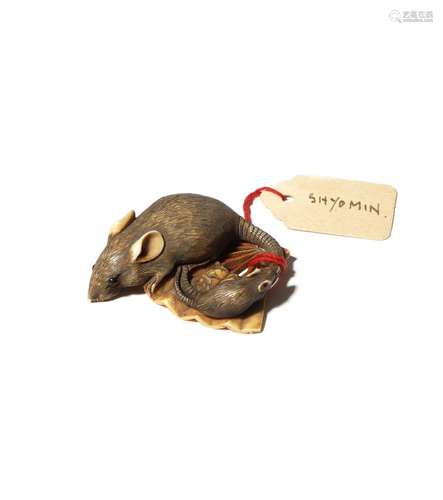 A JAPANESE IVORY NETSUKE OF RATS EDO PERIOD, 19TH CENTURY Carved as a large rat and its young on