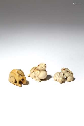 THREE JAPANESE IVORY NETSUKE OF RABBITS EDO AND MEIJI PERIOD, 19TH CENTURY One netsuke carved as a