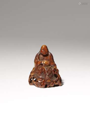 A JAPANESE STAINED IVORY NETSUKE OF IMMORTALS EDO PERIOD OR LATER, 19TH CENTURY Stained and carved