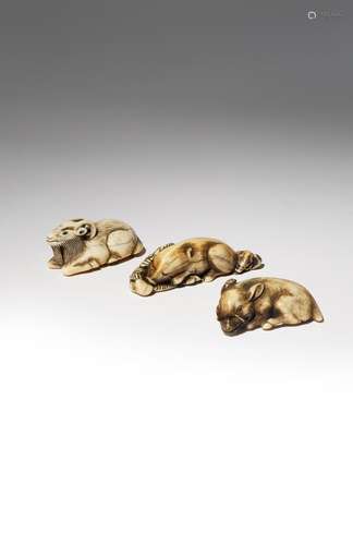 THREE JAPANESE IVORY NETSUKE OF RECUMBENT MAMMALS EDO PERIOD AND LATER, 18TH AND 19TH CENTURY Two