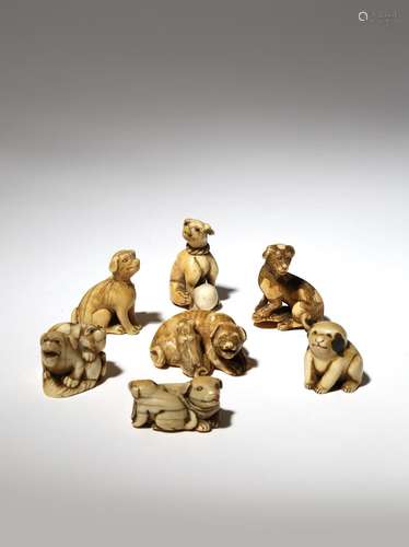 SEVEN JAPANESE IVORY NETSUKE OF DOGS EDO PERIOD AND LATER, 18TH AND 19TH CENTURY Depicted in a