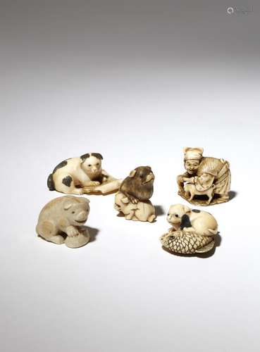 FIVE JAPANESE IVORY NETSUKE OF DOGS MEIJI PERIOD, 19TH CENTURY The first depicting Hanasaka Jiisan