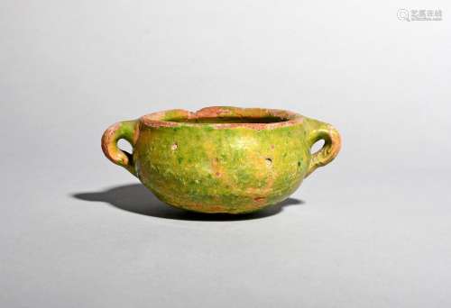 A small earthenware colander or strainer, 15th century or later, the rounded form of a reddish