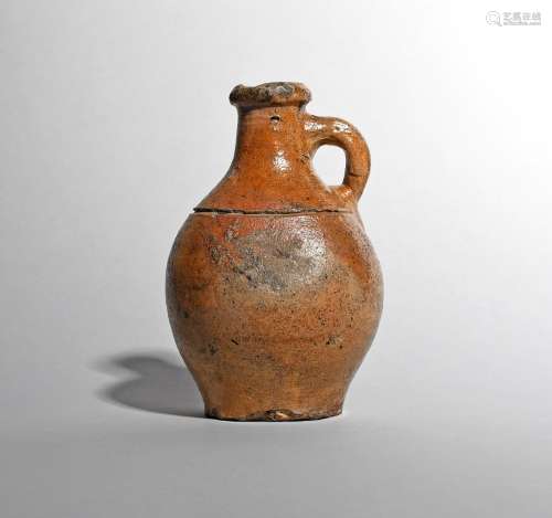 A small brown stoneware bottle or flagon, 18th/19th century, the diminutive form incised with a
