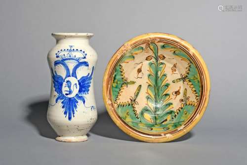 A Spanish maiolica bowl, mid 18th century, probably Puente del Arzobispo, painted in shades of