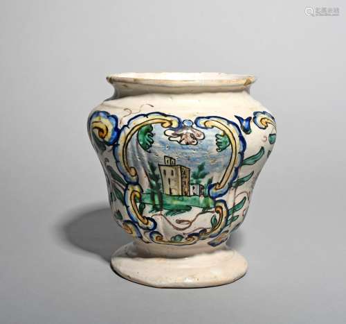 A Continental maiolica storage jar, dated 1742, probably Italian, the baluster form moulded with