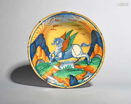 A rare Italian maiolica dish, probably 17th century, boldly decorated in blue, green, yellow and